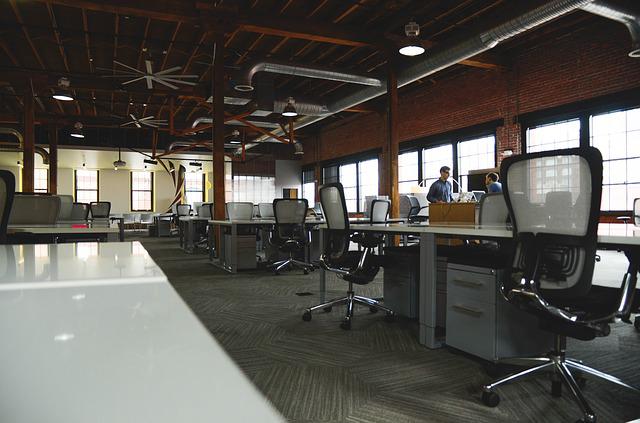 Photo of an empty office with desks and chairs