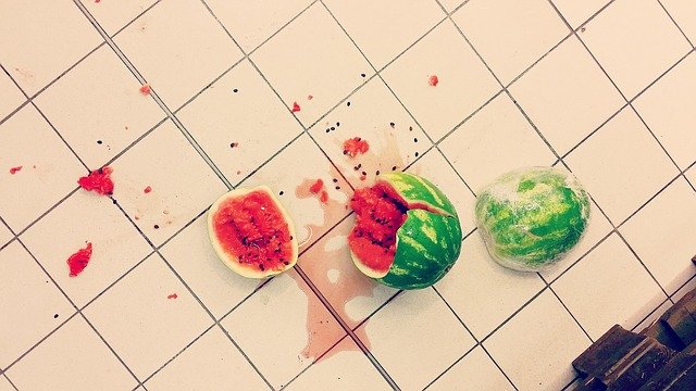 Accident at home, broken watermelon on floor