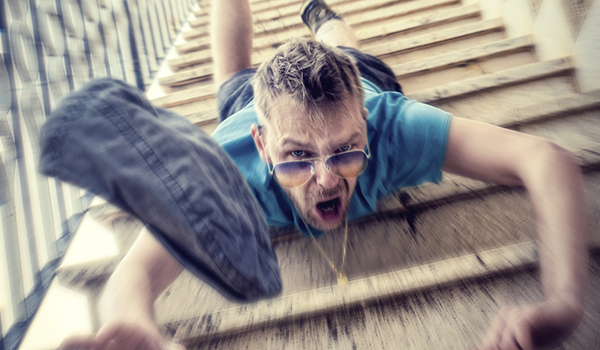 Man falling down stairs outside