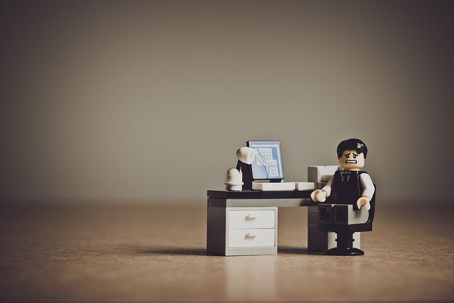 block man at desk - Image by www_slon_pics from Pixabay