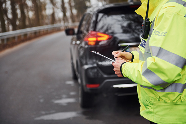 Police officer issuing a parking ticket
