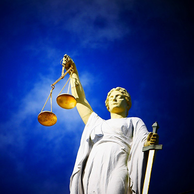 Justice statue with scales and sky in background - by Edward Lich from Pixabay