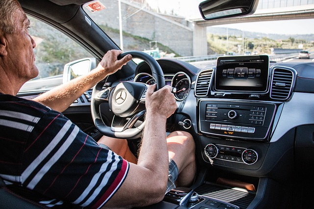 Older driver at the steering wheel