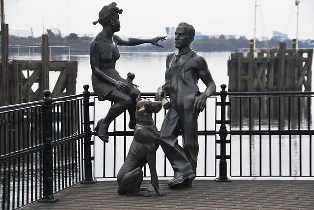 Couple and dog statue in Cardiff Bay - Image by Dean Moriarty from Pixabay