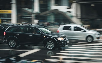 Cars speeding along the road